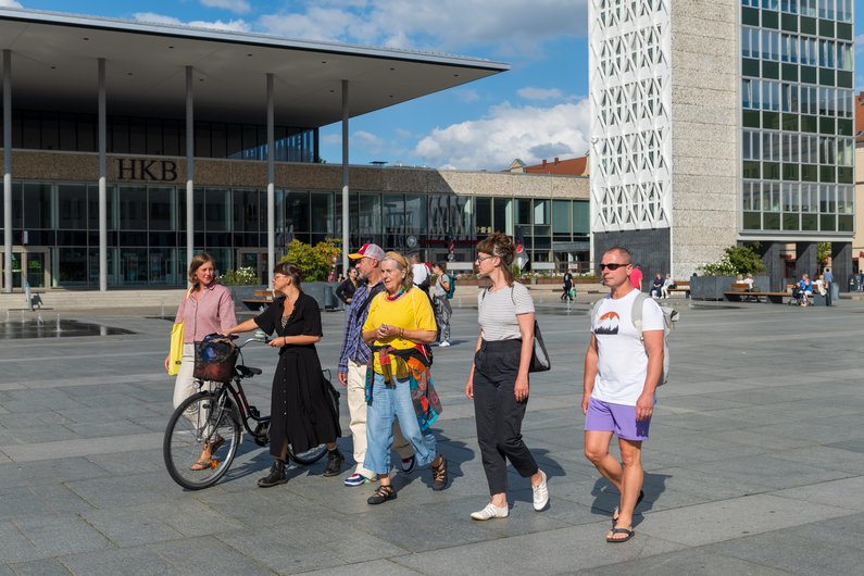 The New Patrons of Neubrandenburg A group is walking through the city.