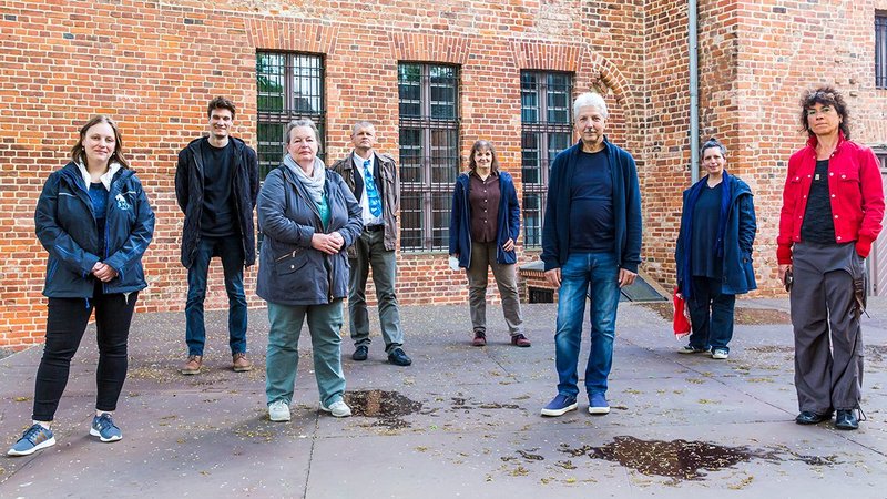 The New Patrons in front of a building in Beeskow