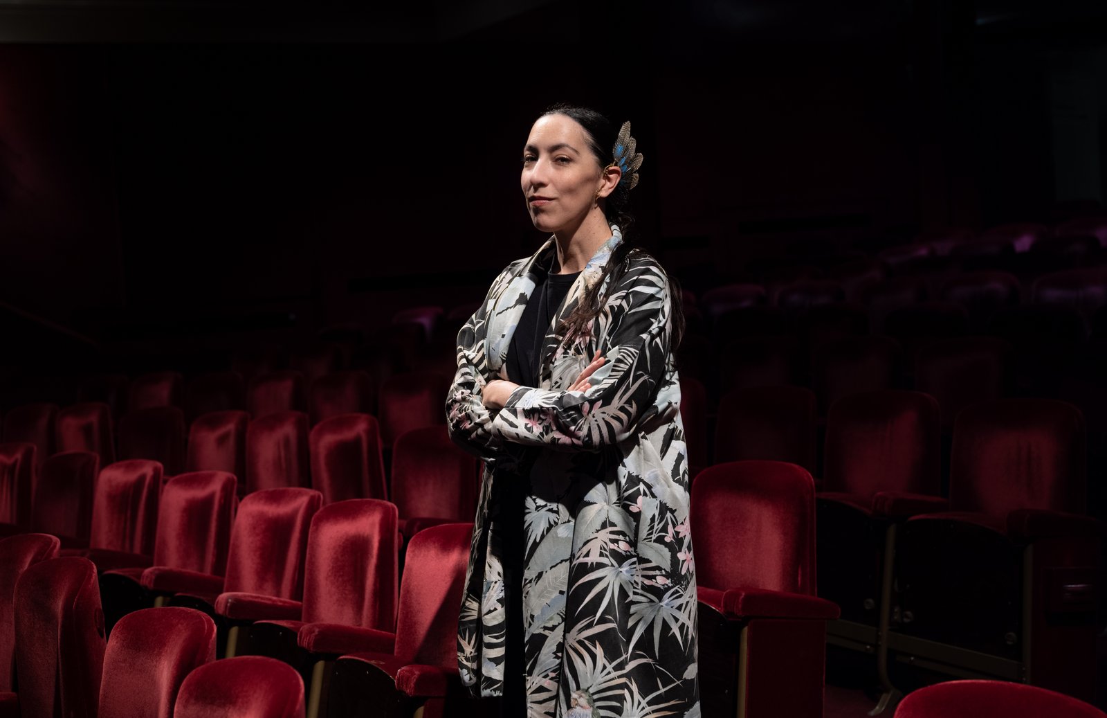 Portrait of a person, standing in a theater 