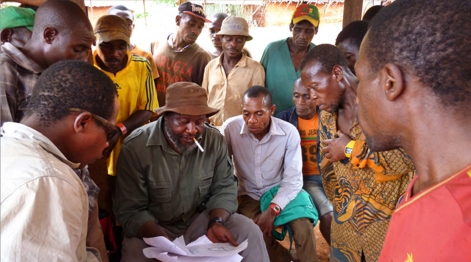 The New Patrons of Bifolone. Mediator Germain Loumpet and the new patrons at a preparation meeting. Dja Faunal Reserve, Cameroon, 2016