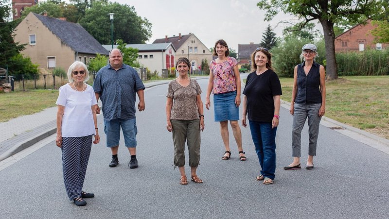 Group of The New Patrons of Steinhöfel standing in the village 