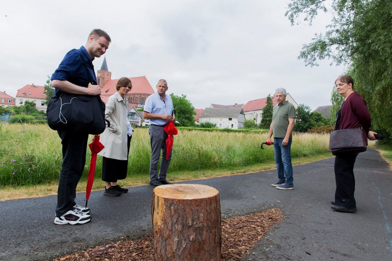 New Patrons on the street of Beeskow with artist Simon Denny