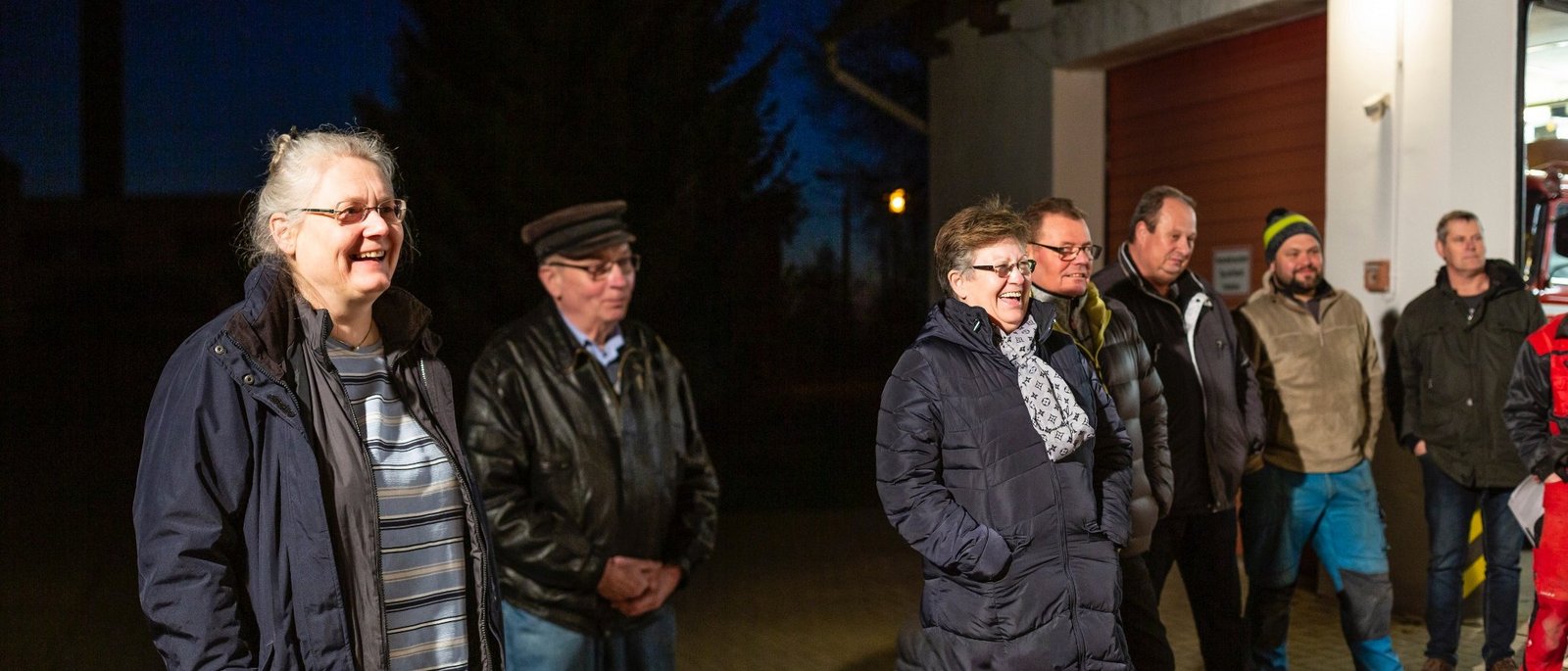 Members of The New Patrons of Züsedom standing at a meeting