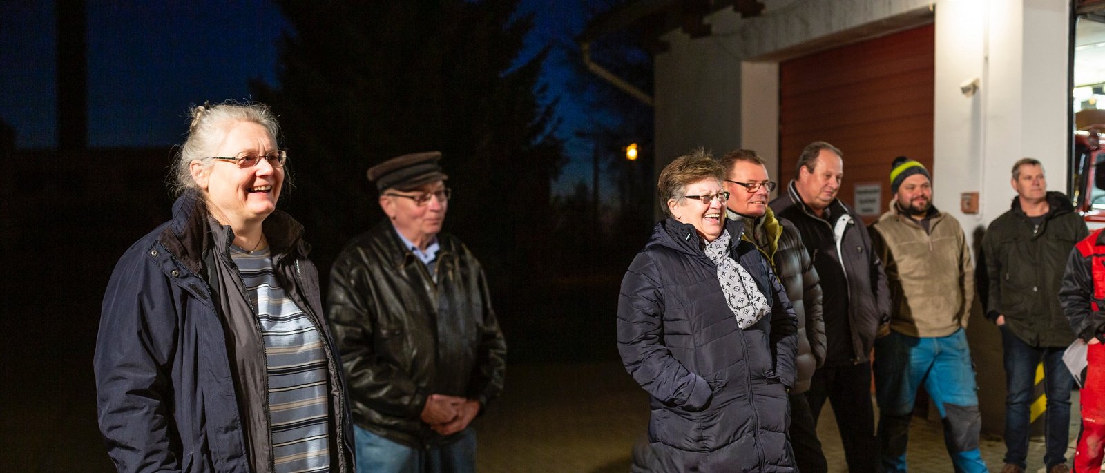 Members of The New Patrons of Züsedom standing at a meeting